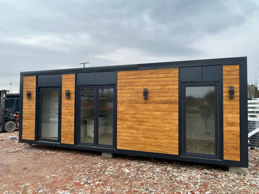 Grand contenedor para oficina con cabina de ducha y muebles de cocina